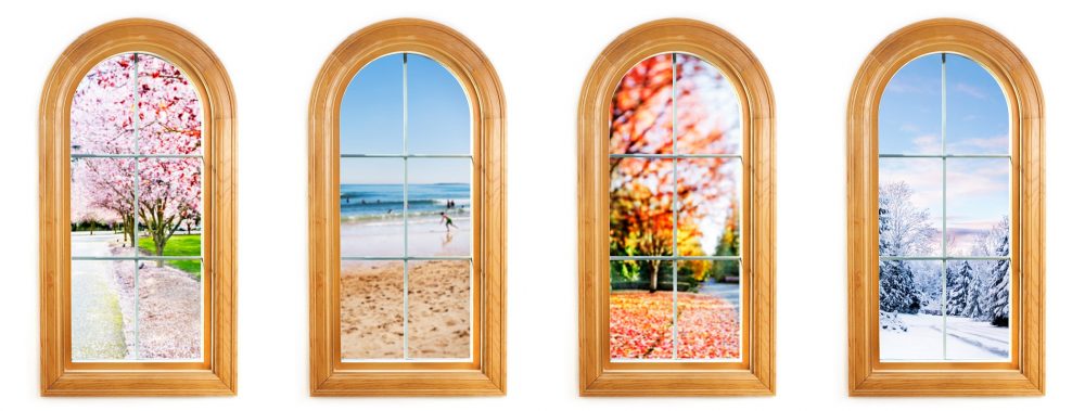Round top window with views of spring, summer, fall and winter